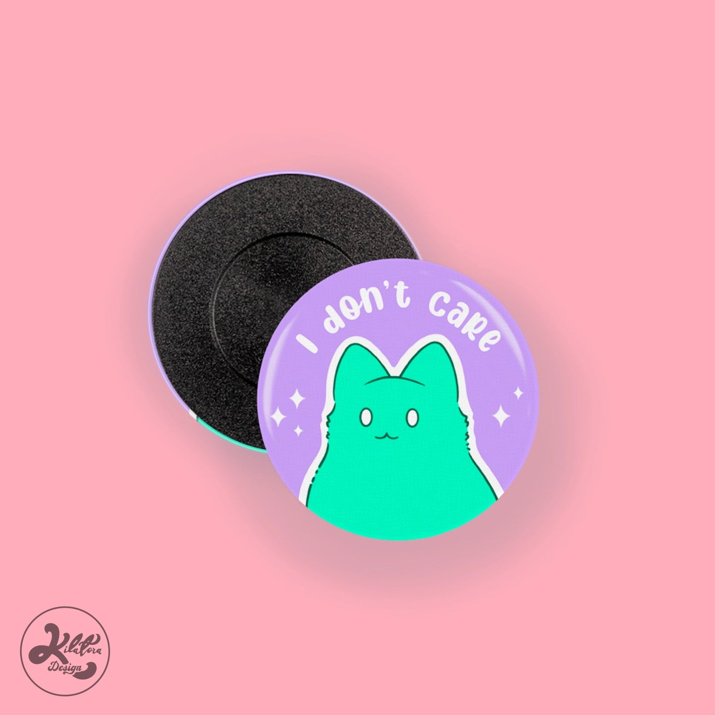 38mm magnet by Kilatora Design. Purple pin with a green kitty and text "I don't care".