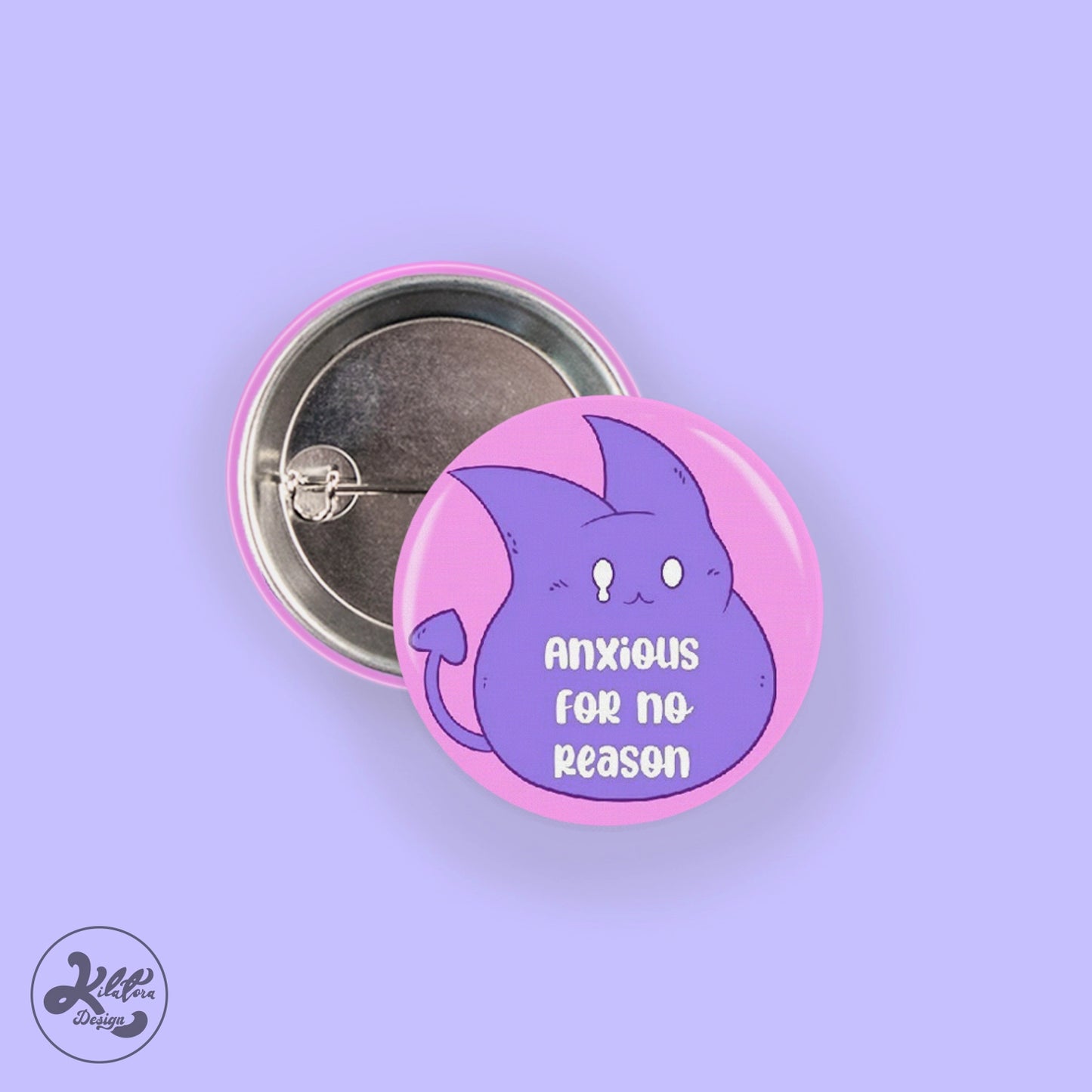 38mm button pin by Kilatora Design. Pink color with purple devil Tora character and text "nxious for no reason".