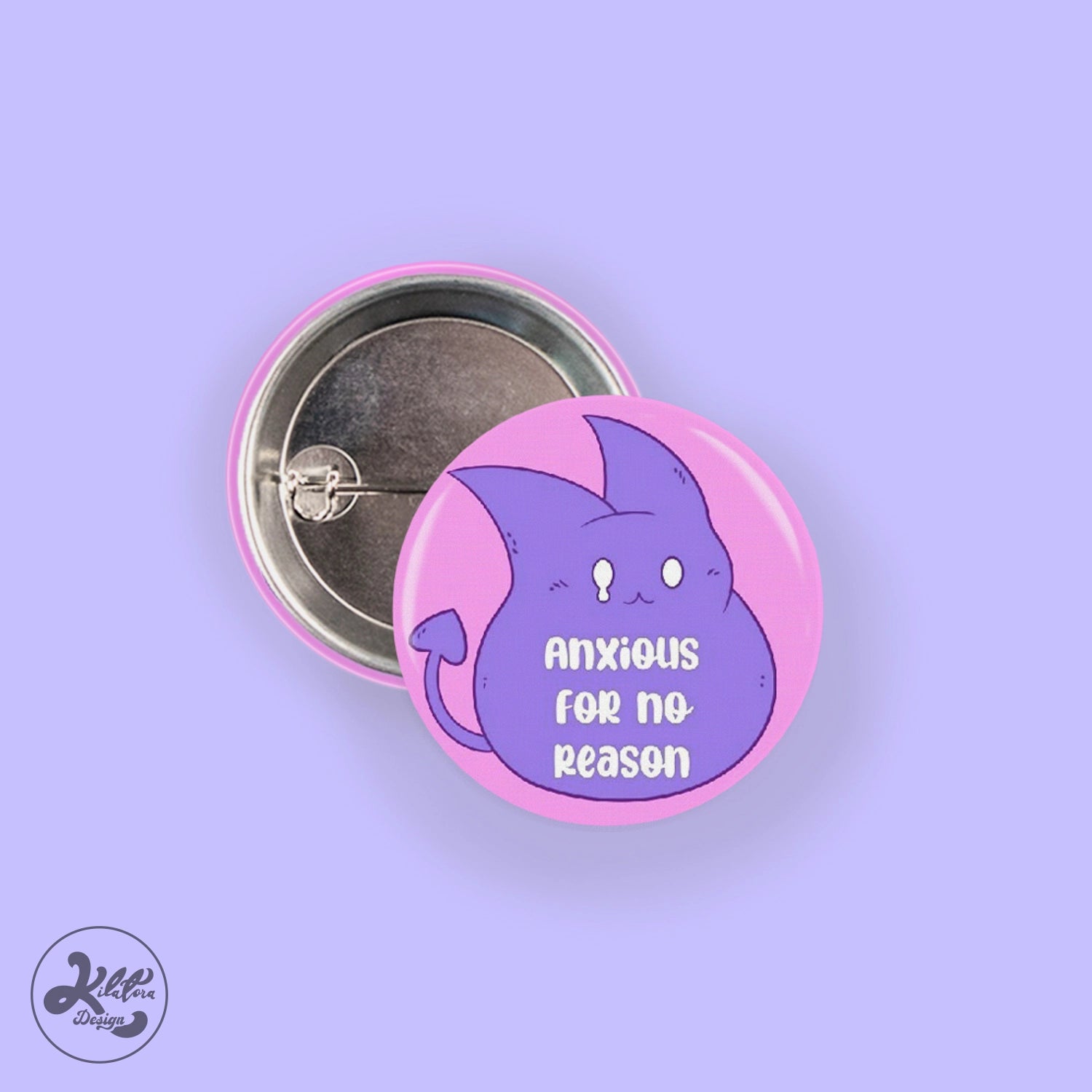 38mm button pin by Kilatora Design. Pink color with purple devil Tora character and text "nxious for no reason".