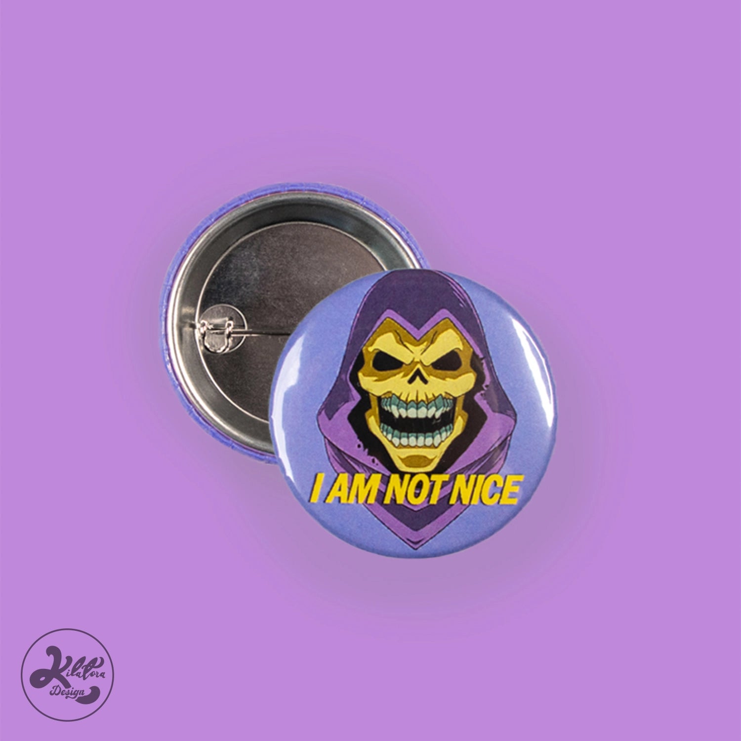 38mm button pin by Kilatora Design. Purple color with Skeletor and text "I am not nice".