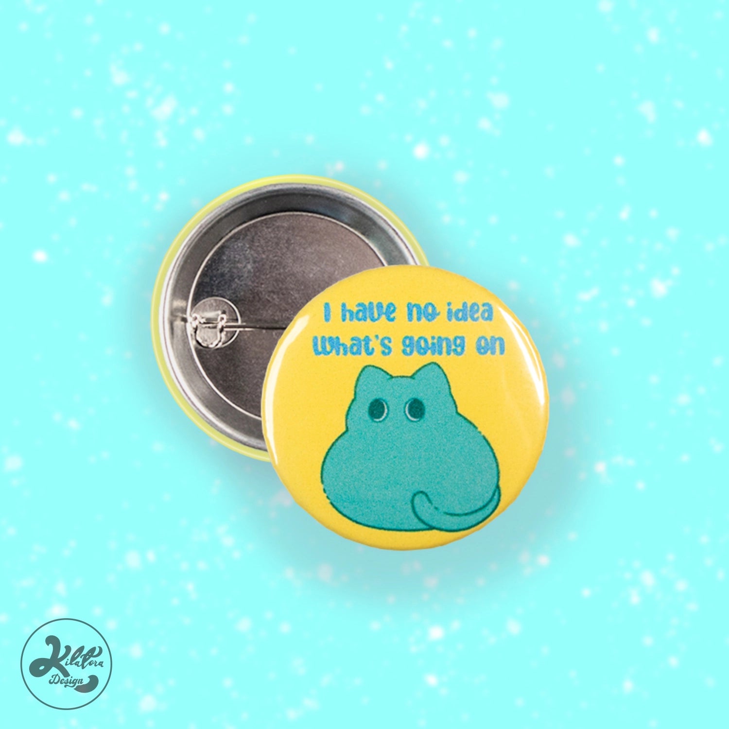 38mm button bin by Kilatora Design. Yellow color with green cat and text "I have no idea what's going on.
