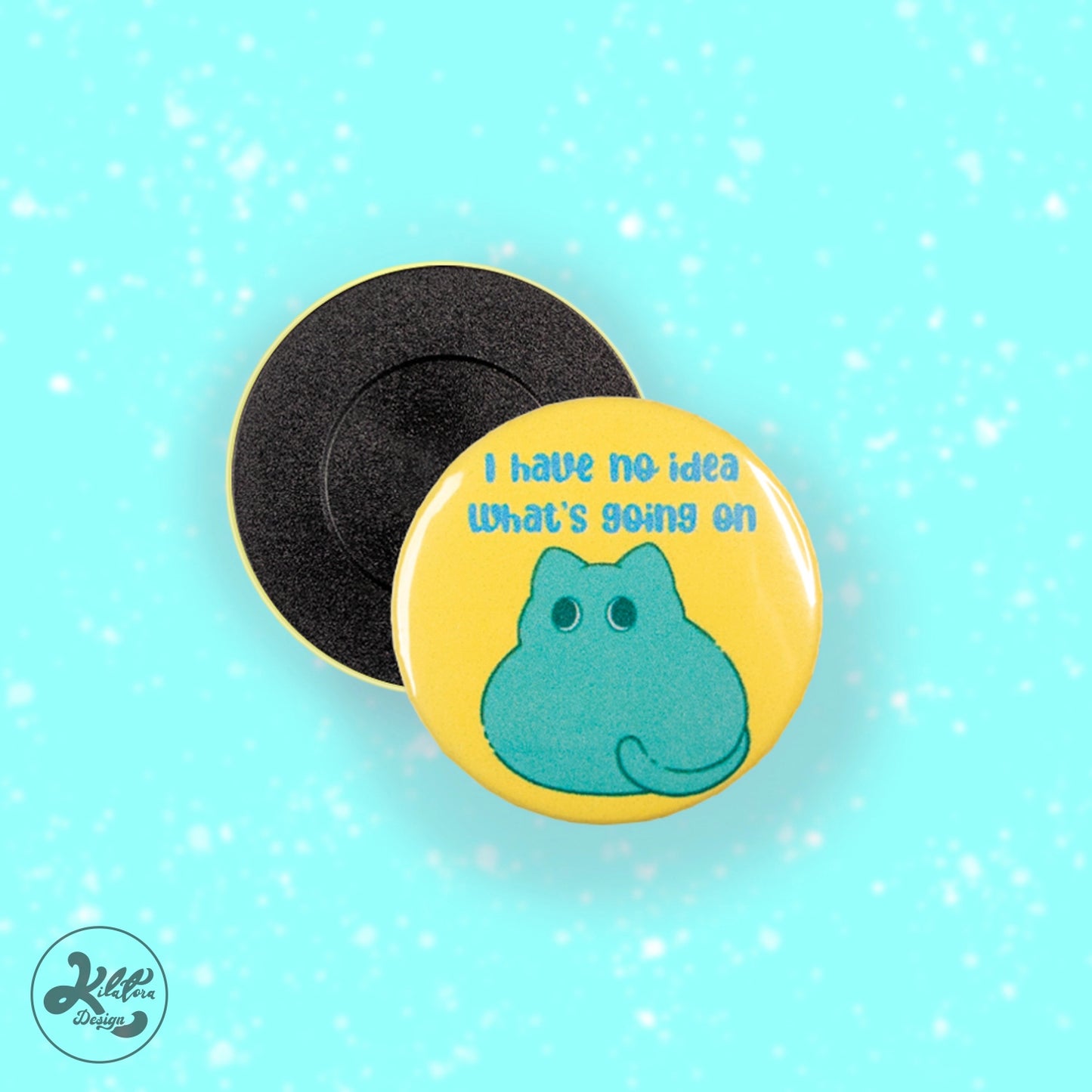 38mm magnet by Kilatora Design. Yellow color with green cat and text "I have no idea what's going on.