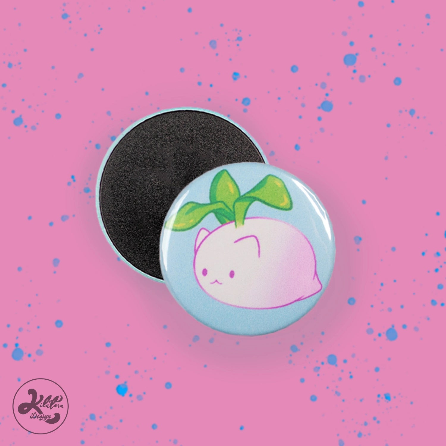 38mm magnet by Kilatora Design. Light blue color with white and pink turnip cat with green leaves.