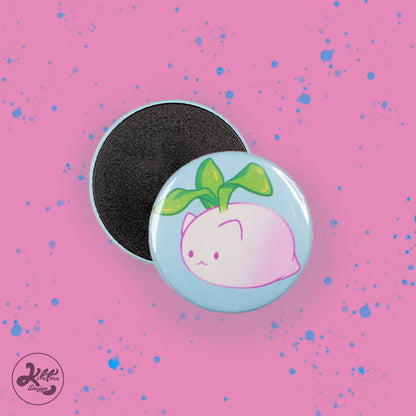 38mm magnet by Kilatora Design. Light blue color with white and pink turnip cat with green leaves.