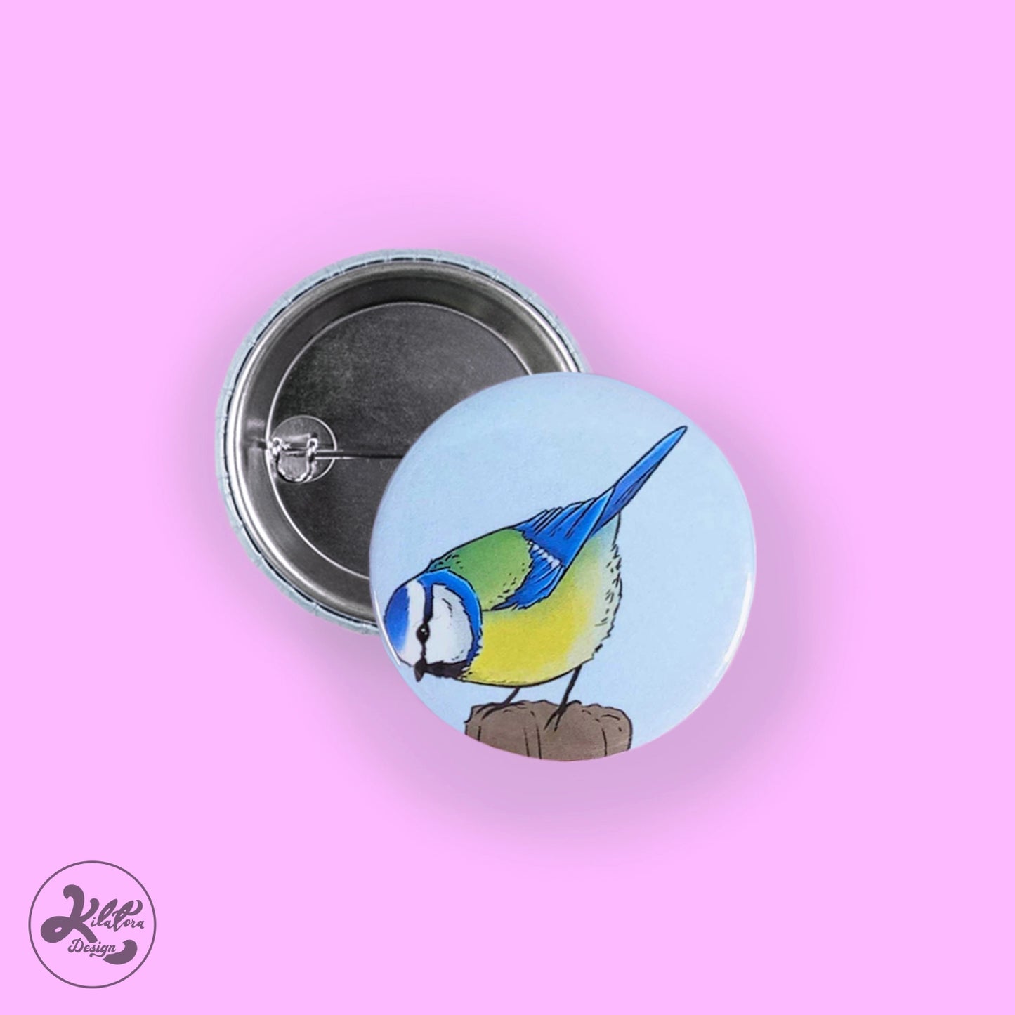38mm button pin by Kilatora Design. Blue background with blue tit art.